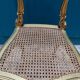 Antique rococo chair in gilded wood and caning