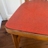 Baumann chair stamped in red skai