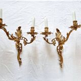 Pair of vintage French wall sconces in bronze, Louis XV Rococo style.