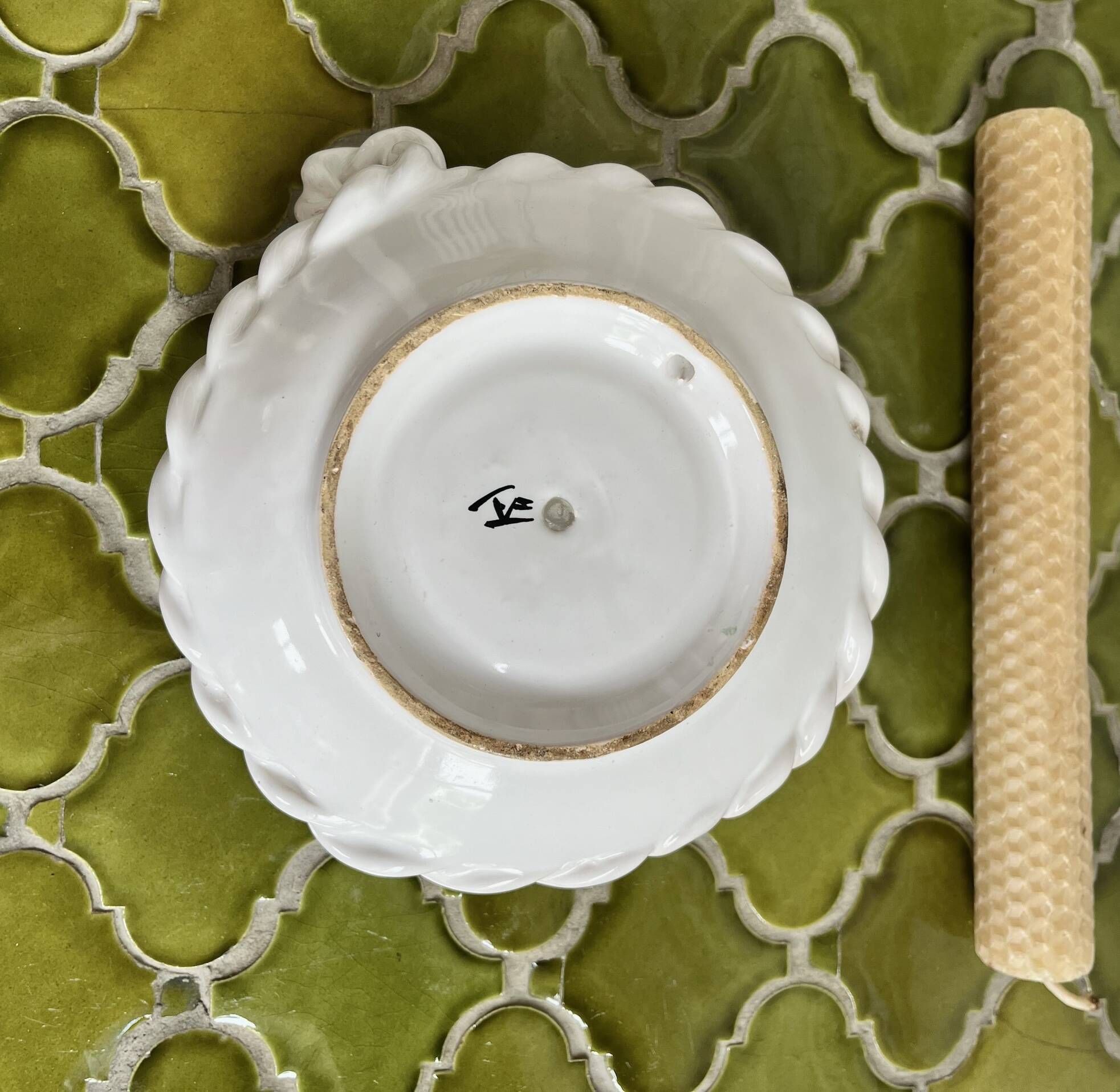 Hand-held candle holder with braided ceramic bowl