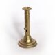 Brass candlestick with a column and bobeche.