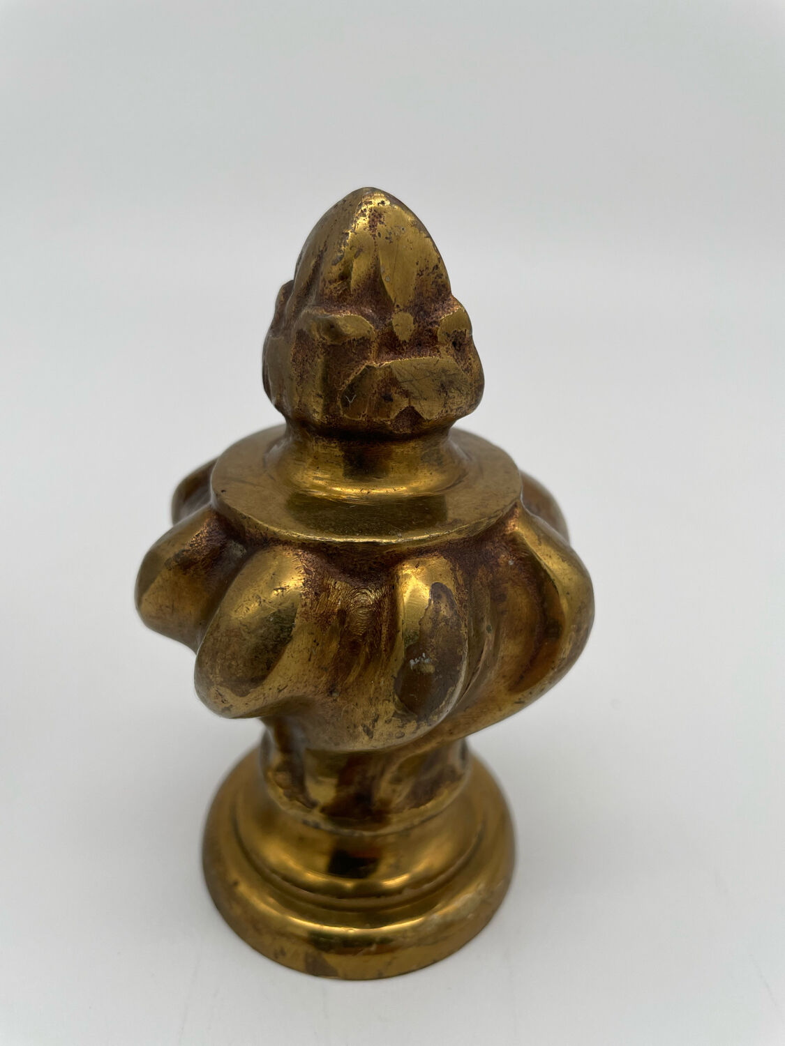 Pair of antique flame curtain rod finials in gilded bronze