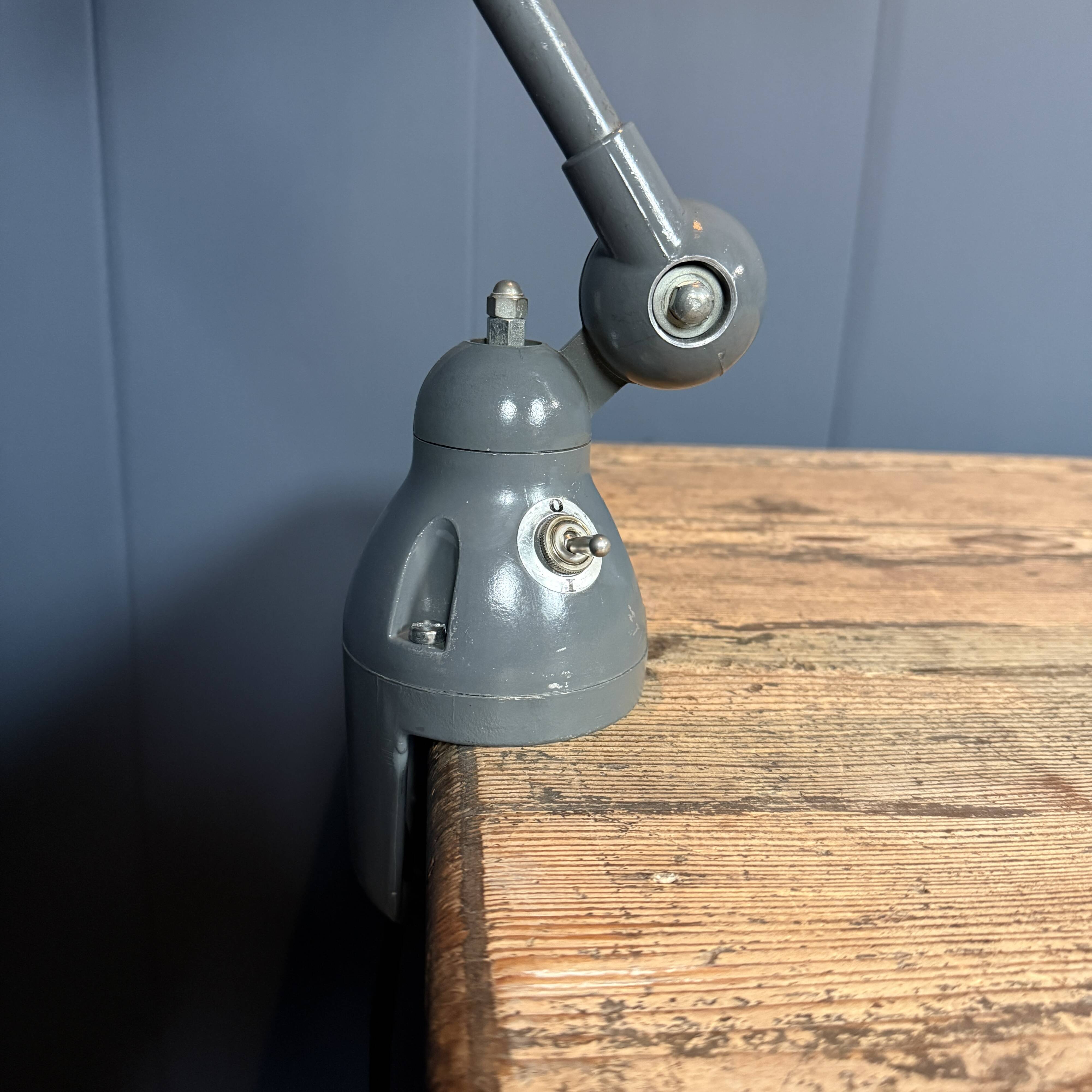 Dark grey Jielde three-arm clamp table lamp