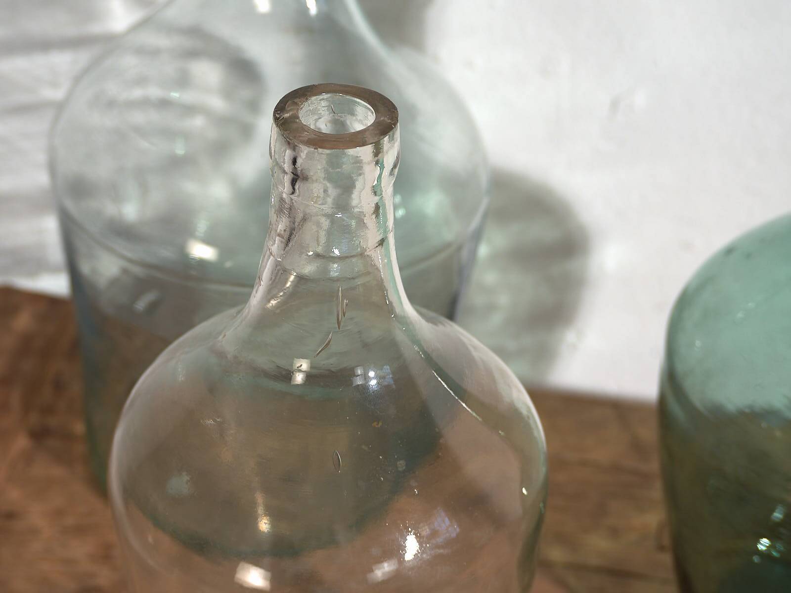 Antique colored demijohns (c.1920). Set of 3 pieces