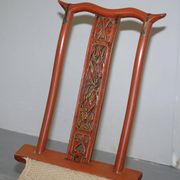 Antique Chinese folding chair with carvings, circa 1900-1920.