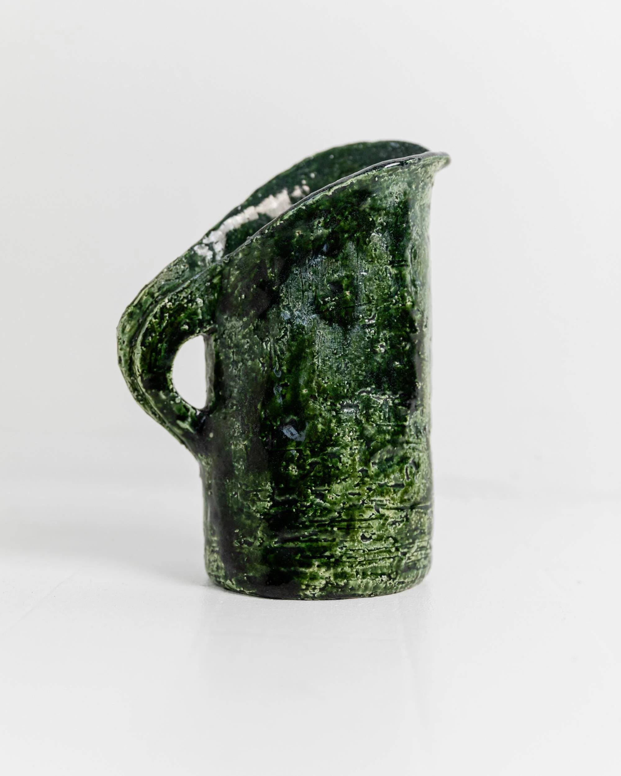 Vintage 1970s studio ceramic vase or pitcher, glazed green.