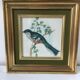 Table reproduction "beautiful colorful bird", gilded wood frame and green fabric
