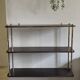 Wooden shelf with gold metal