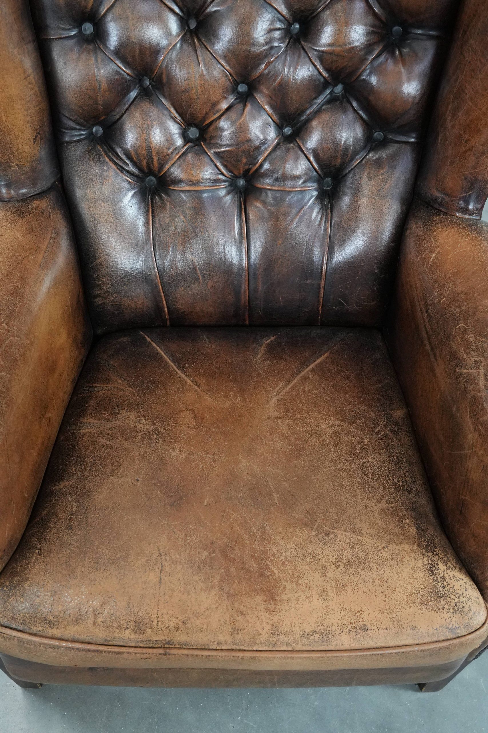 Unique large sheepskin Chesterfield wingback armchair in English style