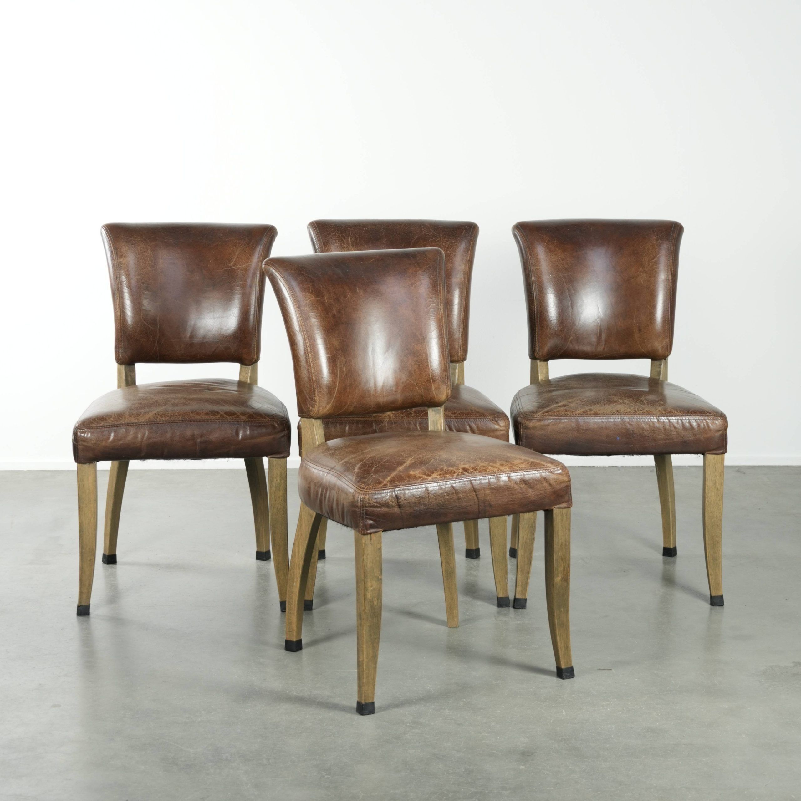 Set of 4 vintage cowhide and wooden dining chairs