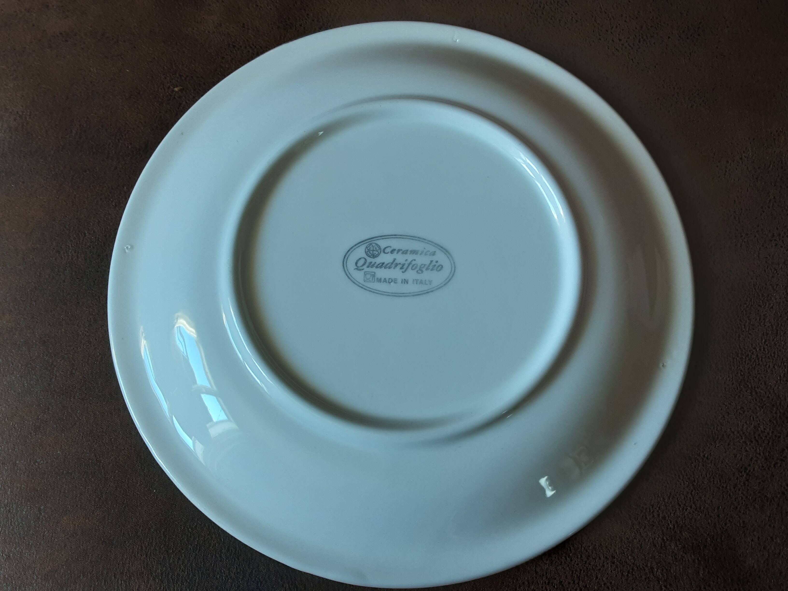 Quadrifoglio dish. Italian. Fruit and flower decoration. Shimmering colors.