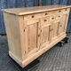 Scandinavian natural pine sideboard with 4 doors and 6 drawers.