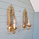 Pair of gold metal wall sconces in Hollywood Regency style, 1970s.