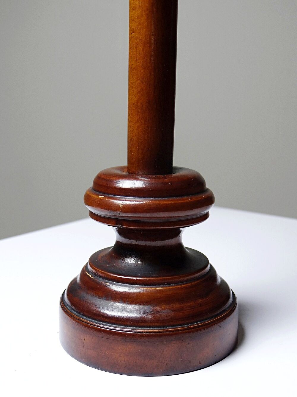Antique wooden altar crucifix with a turned design and silver-plated Christ.