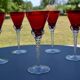 5 red crystal glasses with twisted stems