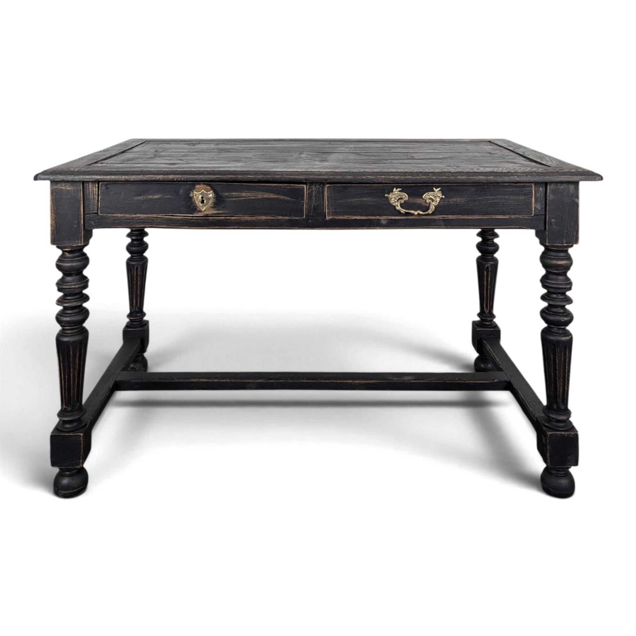 Louis XIII style desk in blackened wood with turned legs and two drawers.