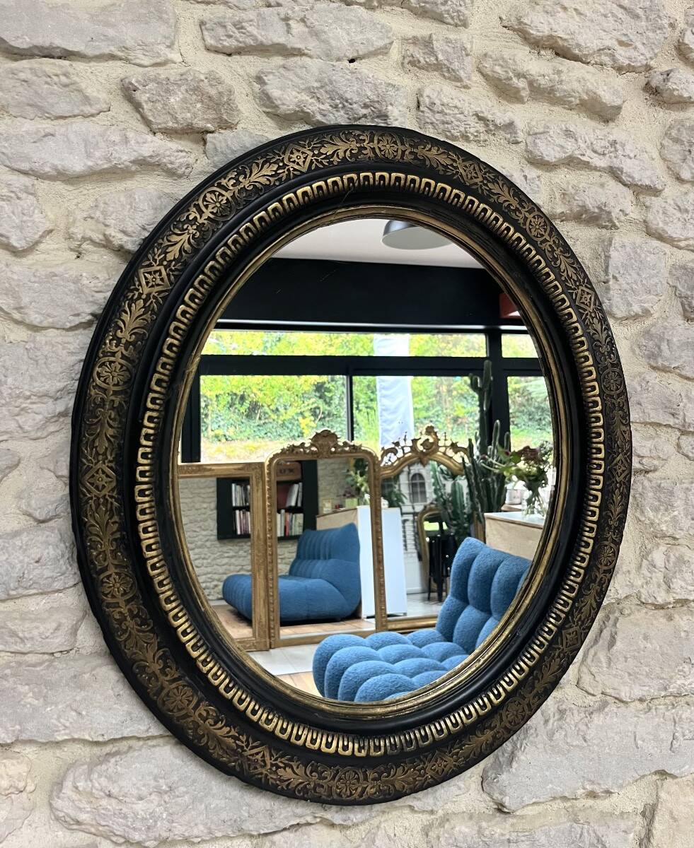 Miroir ancien 61,5/53,5cm ovale époque Napoléon III, noir et doré