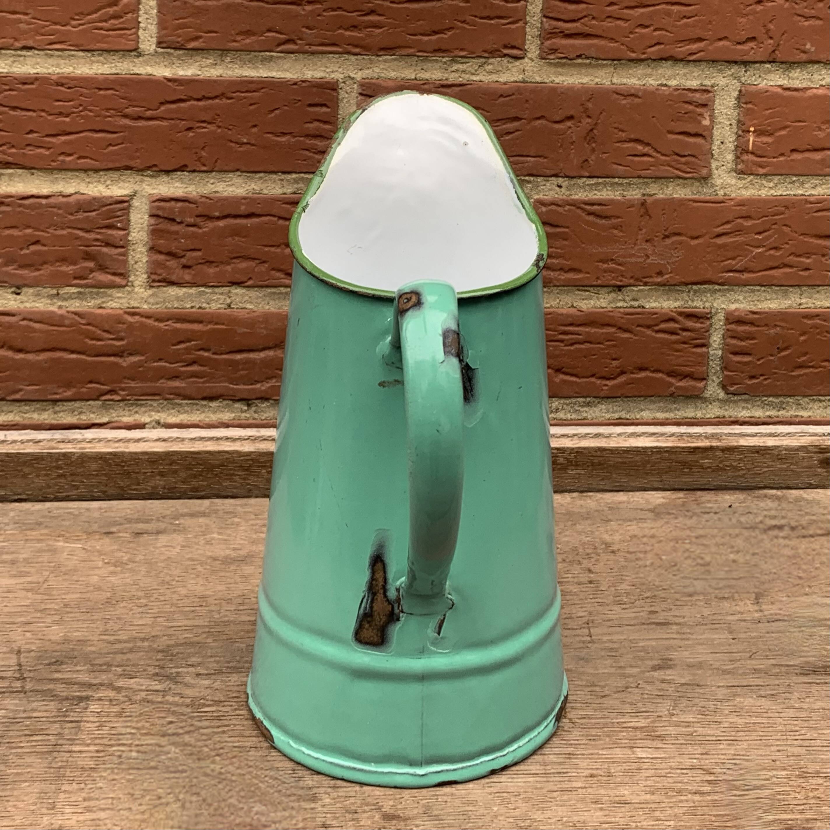 Vintage pitcher in green enameled sheet metal
