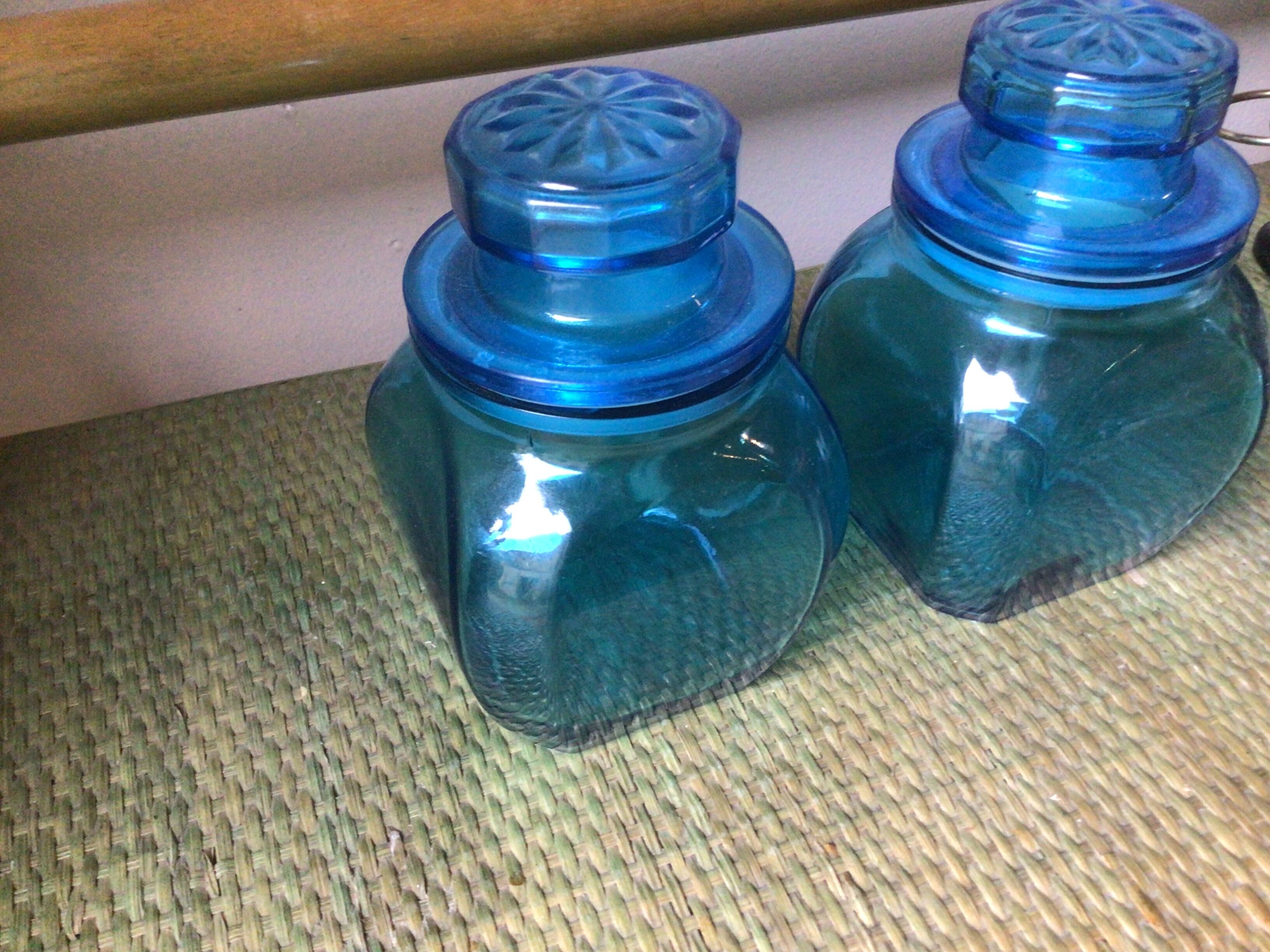 2 blue glass jars