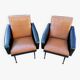 Paire de fauteuils en simili cuir