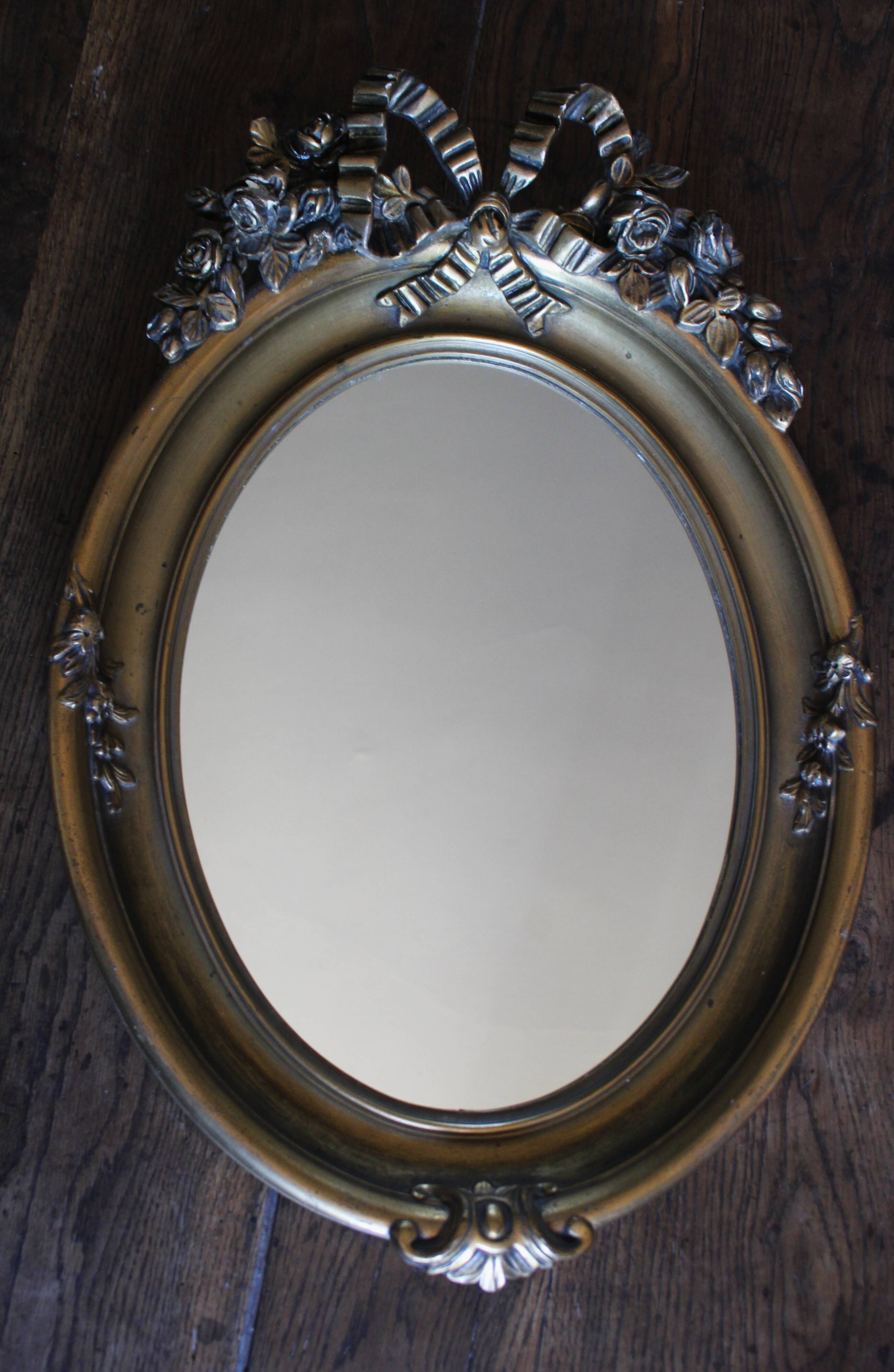 Golden Oval Mirror with Bow and Roses Decor