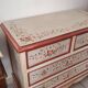 Painted chest of drawers with floral decoration