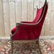 Art Nouveau gondola armchair – Carved wood & red theatre velvet – France