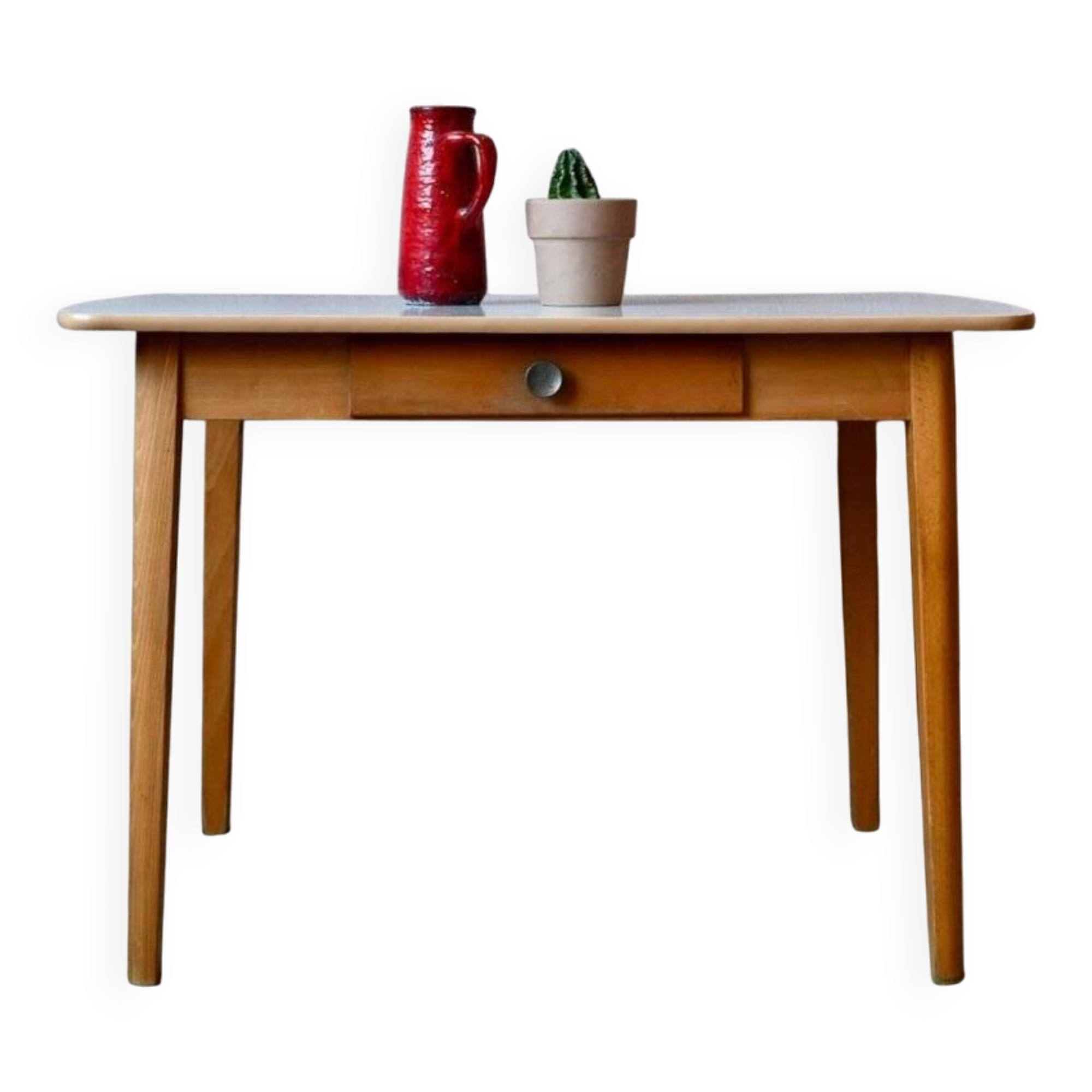 1950s Formica kitchen table with tapered legs and vintage drawer.