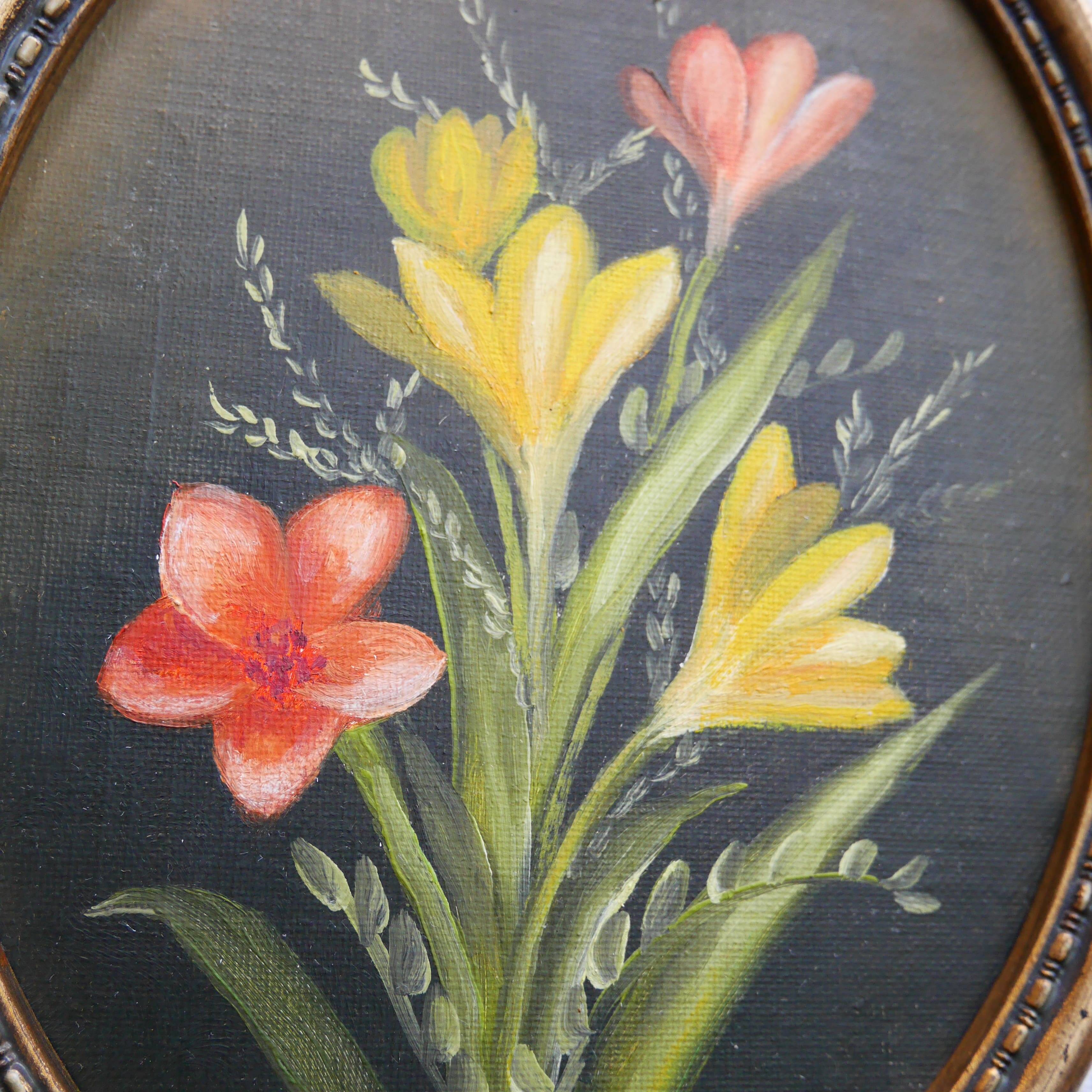 Set of 2 small oval paintings, flowers