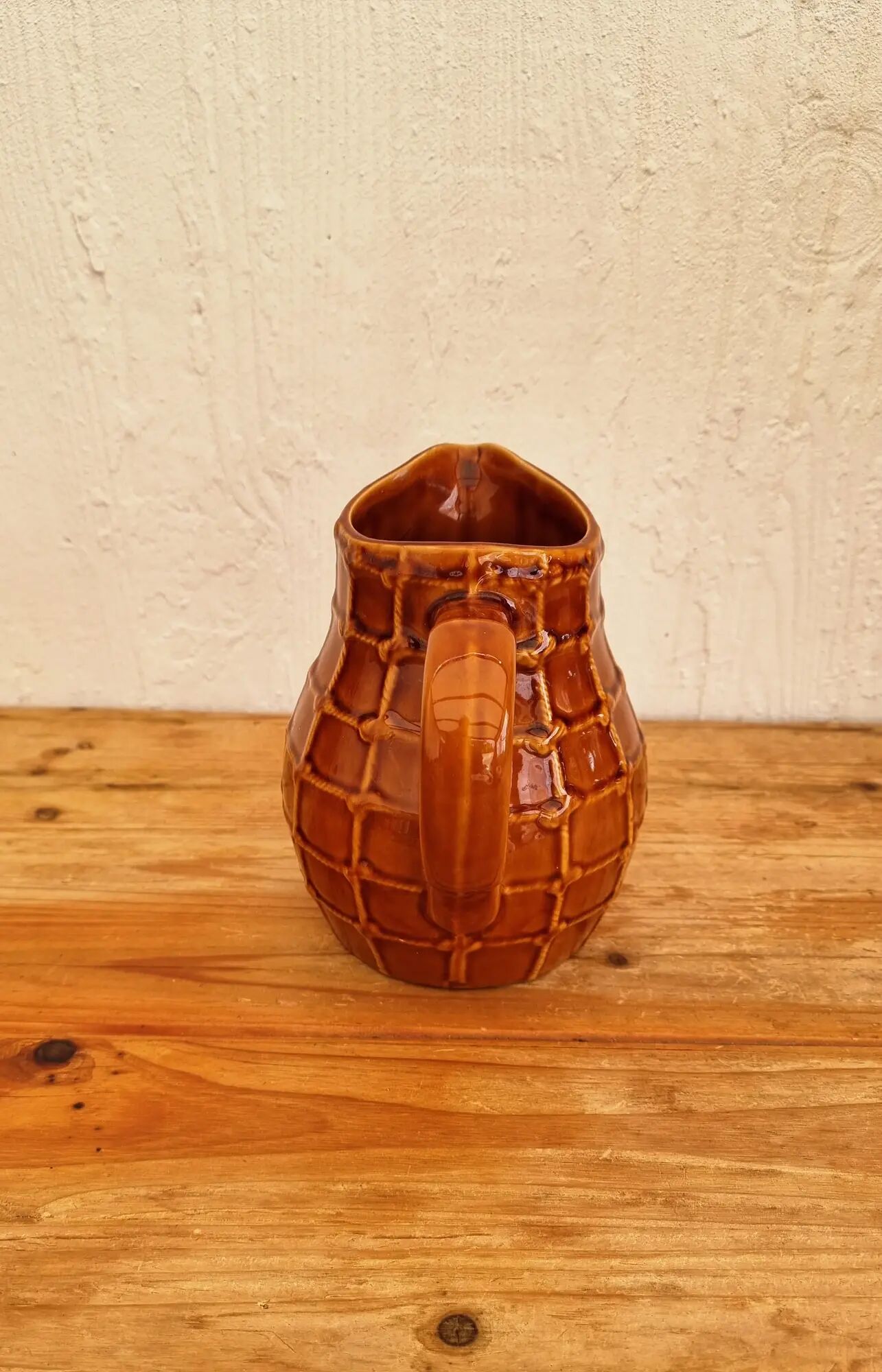 Vintage Saint Clément pitcher with a caramel checkered design.