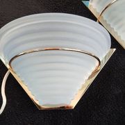 Art Deco wall lights in glass and gilded metal.