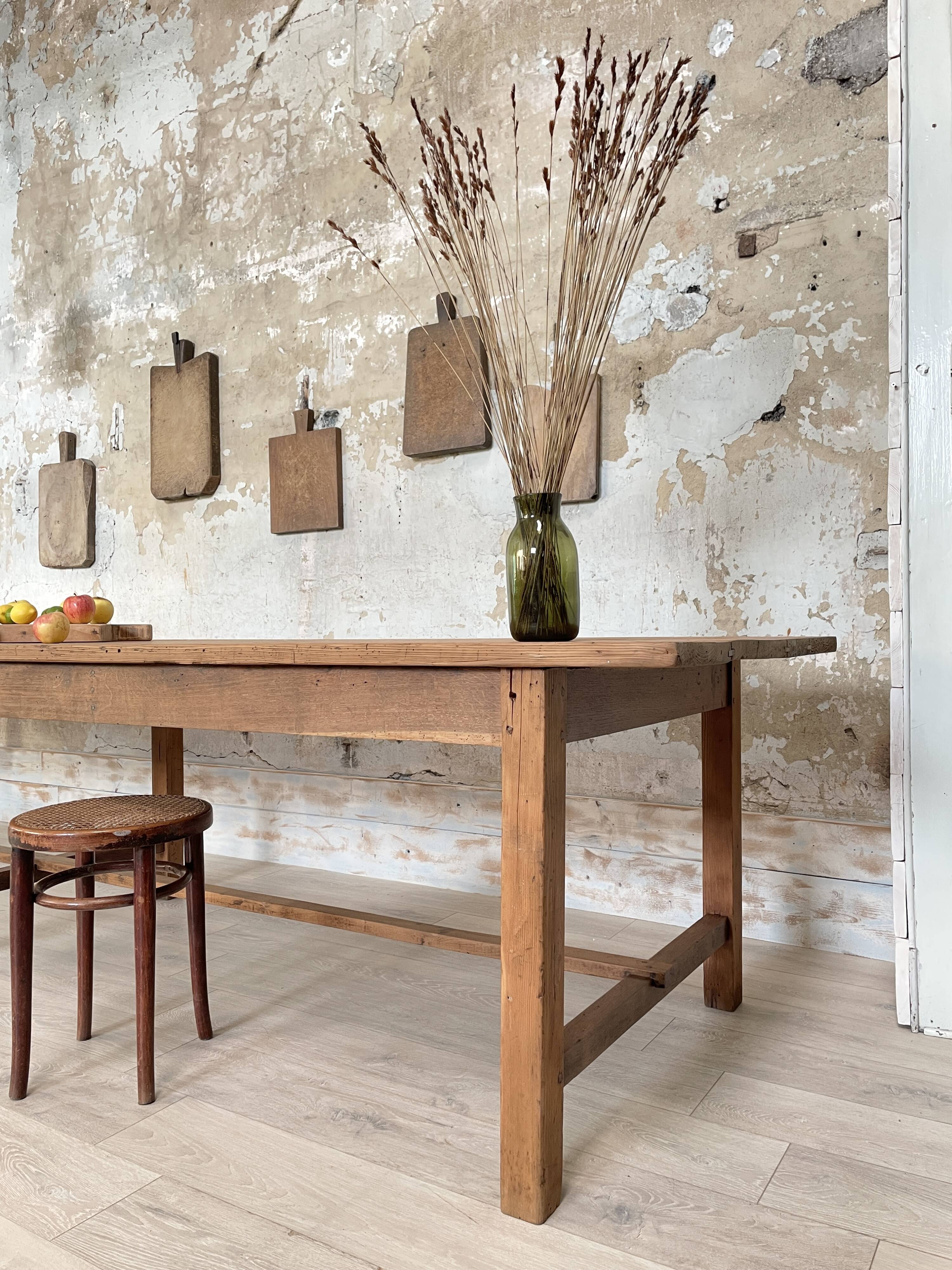 Solid wood workshop table with straight legs.