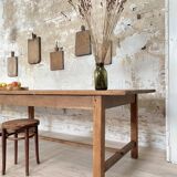 Solid wood workshop table with straight legs.