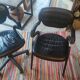 Two black leather armchairs
