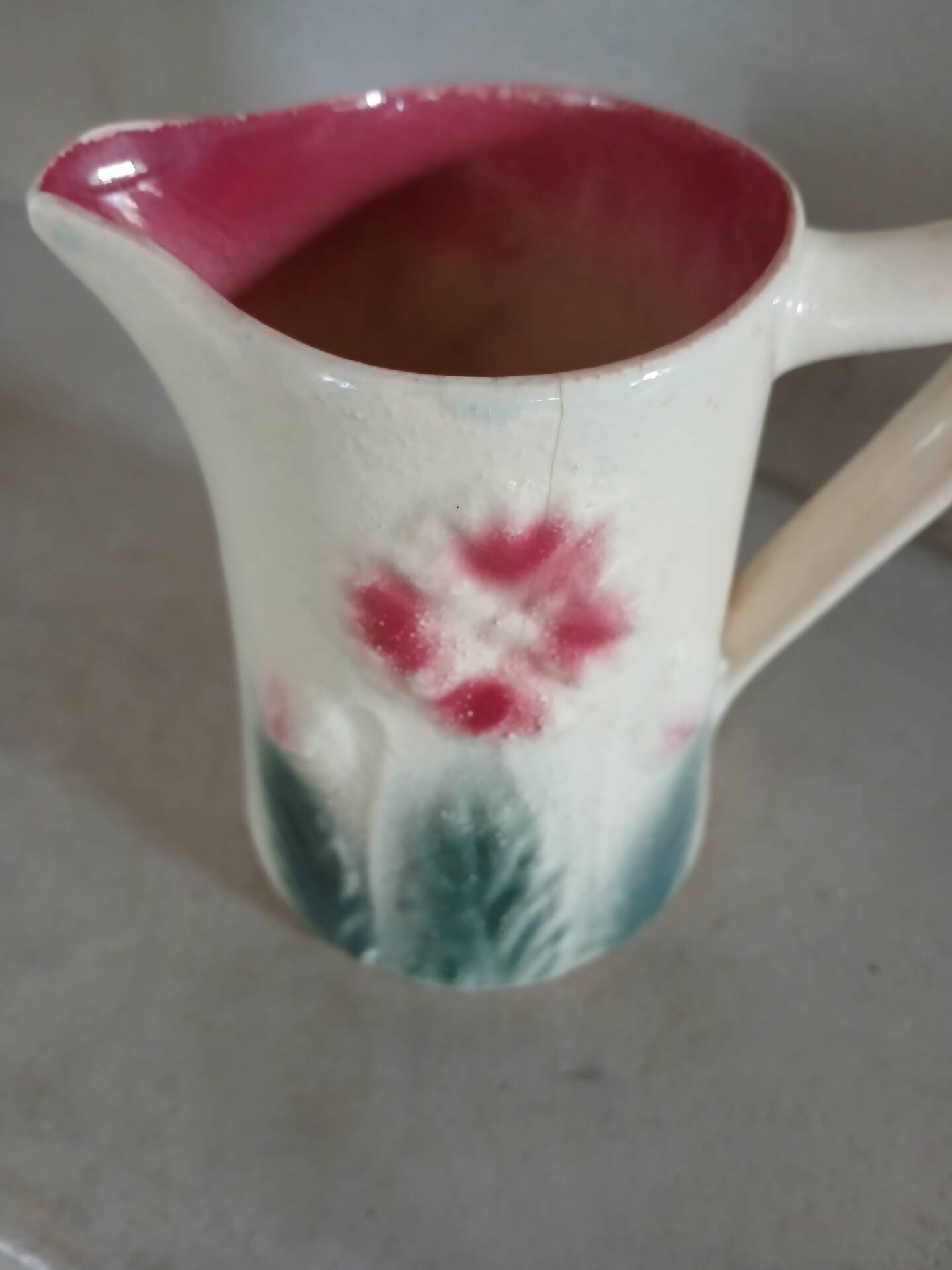 Small antique jug in slipware.