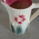 Small antique jug in slipware.