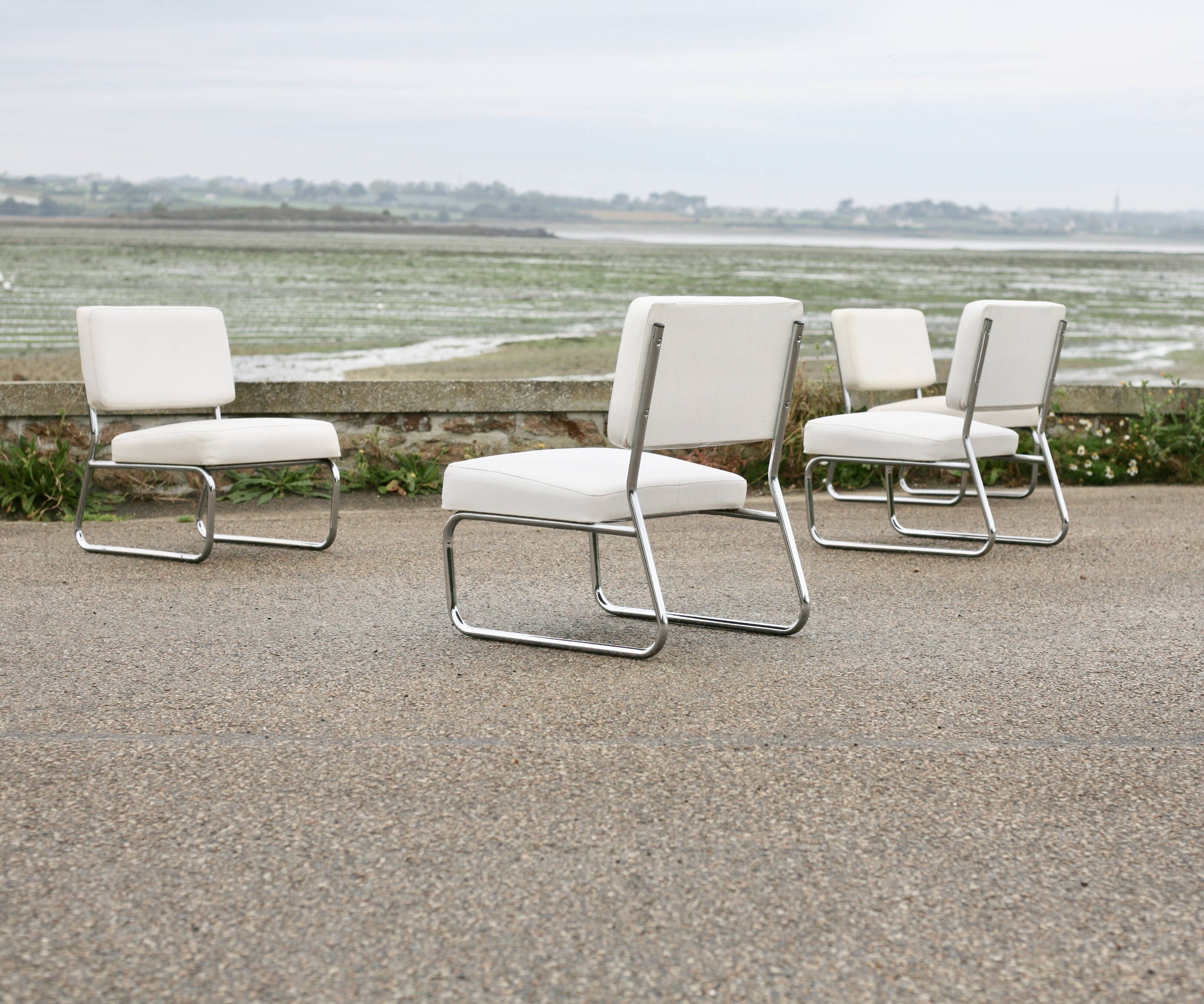 4 armchairs forming a modular sofa. Steel, imitation leather, 70s