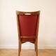 Set of 6 vintage wooden chairs with red faux leather in retro style.