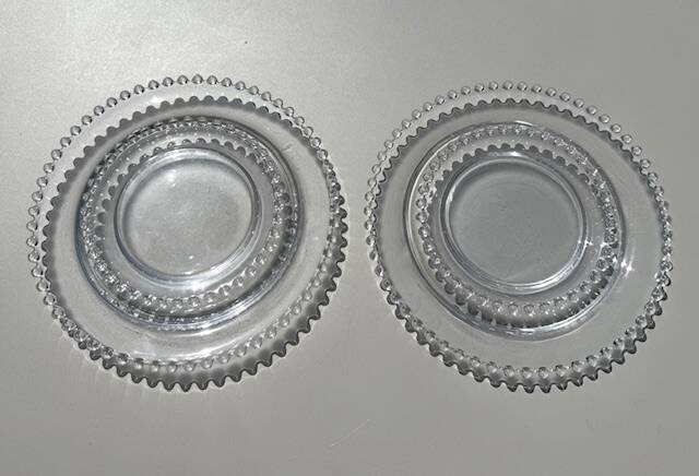 Head to head of crystal plates, Andlau model, signed Lalique