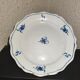 Old plate in Northern earthenware with blue floral decoration eighteenth century