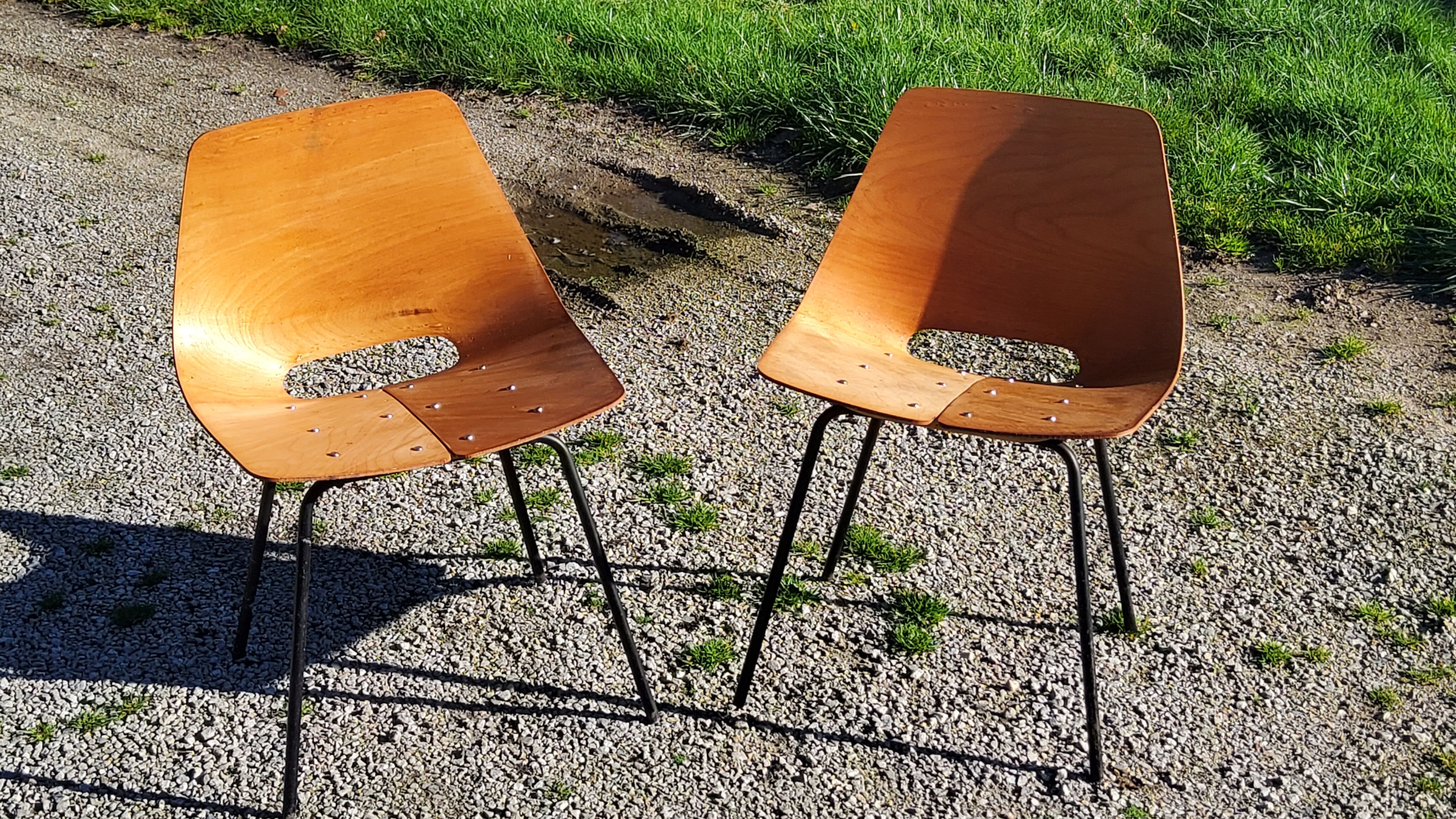 Pair of tonneau chairs by Pierre Guariche plywood base tubes 1954