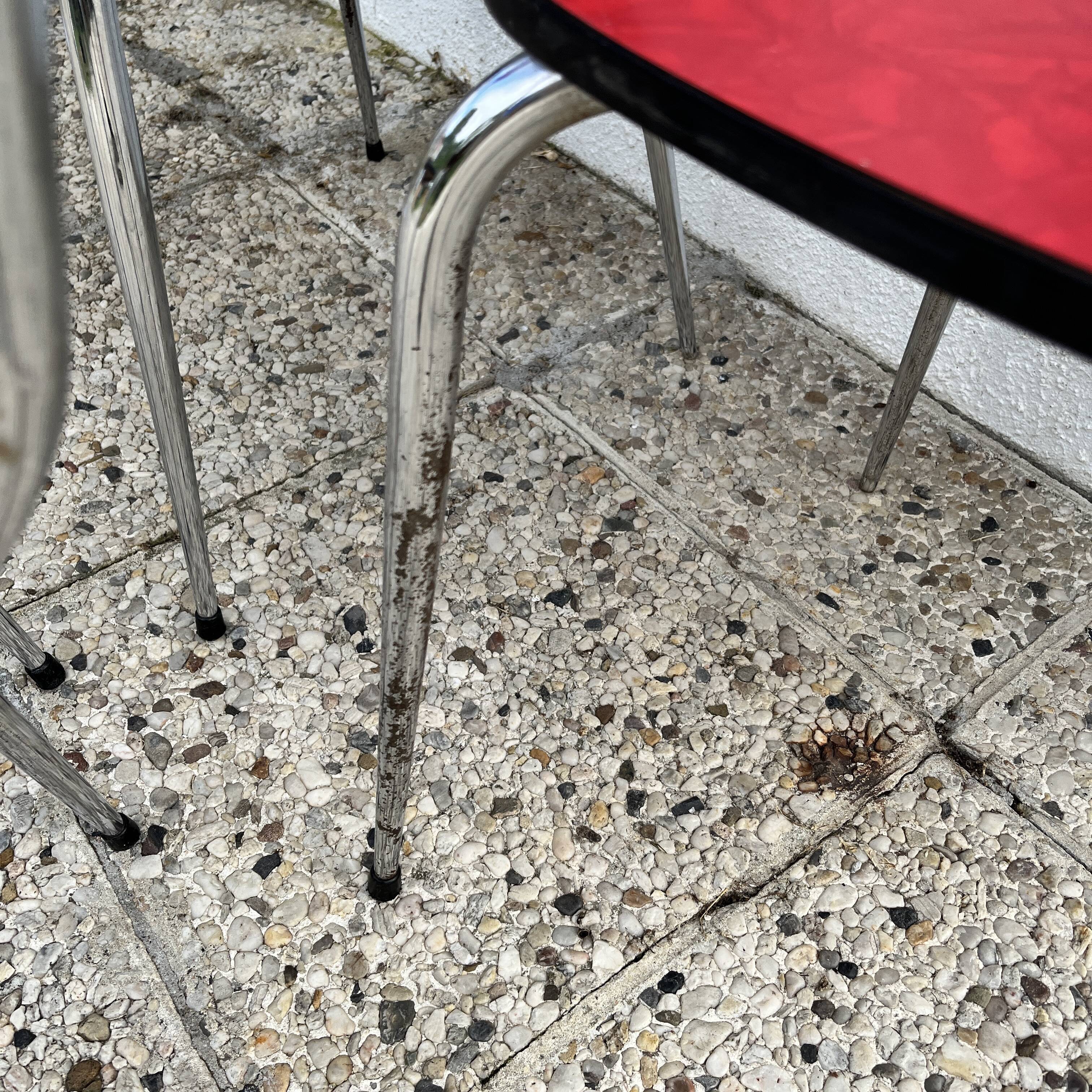 Chairs in formica red foot compass