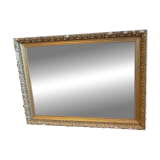 Antique mirror with a wooden and gilded stucco frame.