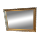 Antique mirror with a wooden and gilded stucco frame.