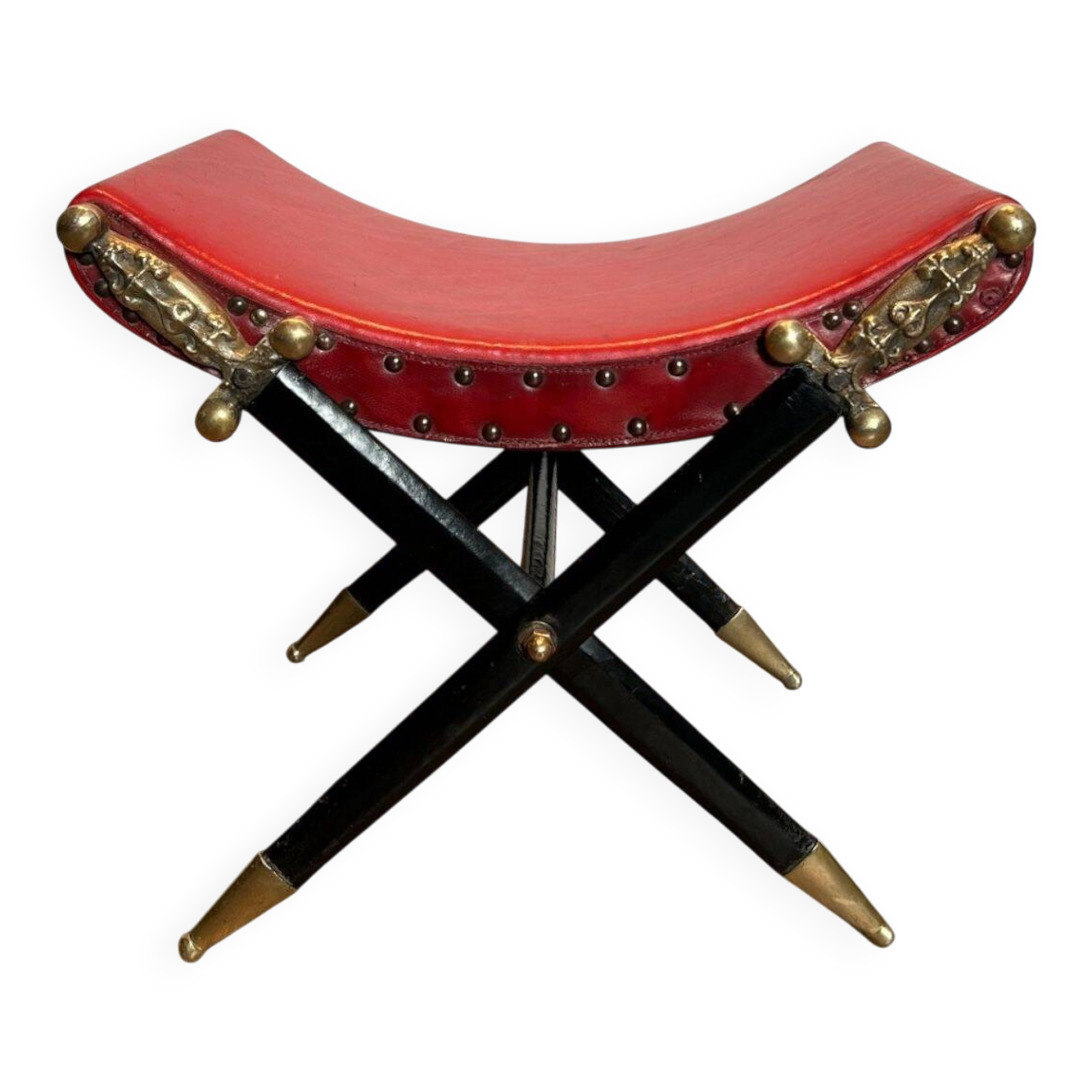 Neoclassical curule stool in red leather, decorated with crossed swords in bronze and metal covered in black leather.