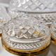 Salad bowl and diamond-shaped bowls in brass.