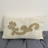 Cushion in vintage fabric with ornamentation
