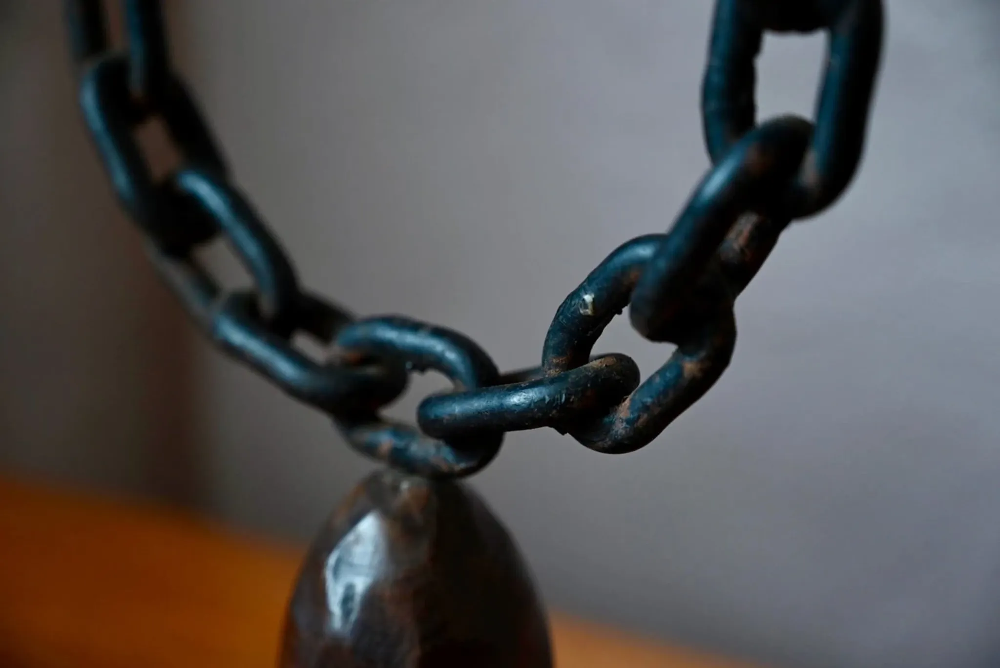 Sculpted wooden and wrought iron brutalist double chandelier from the 1960s.