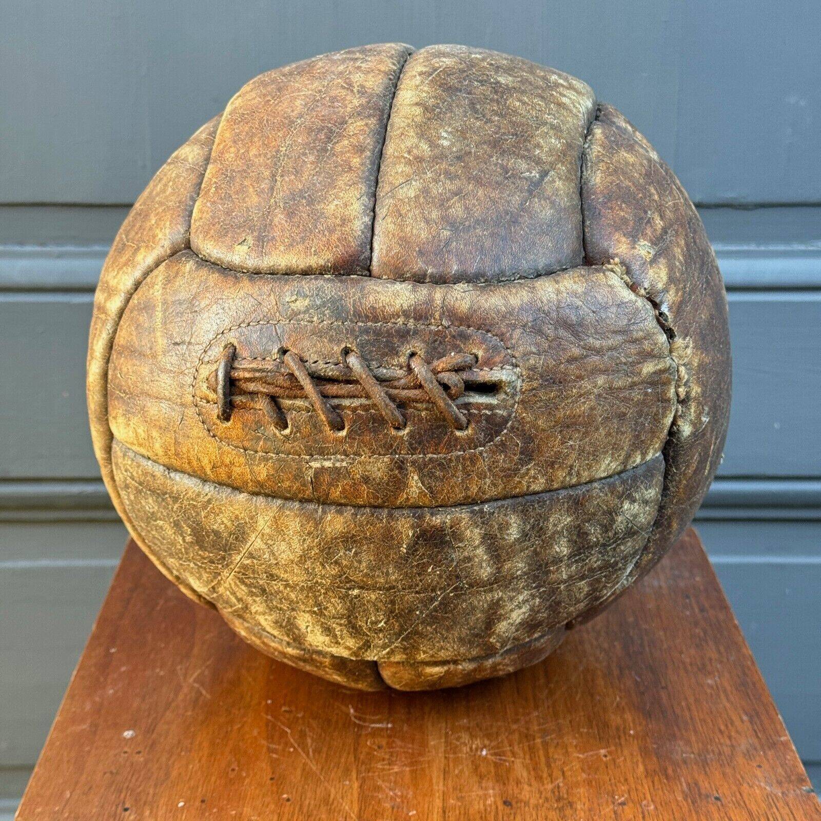 Mid-20th century leather soccer ball with visible stitching and beautiful patina