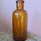 Amber glass bottle vase
